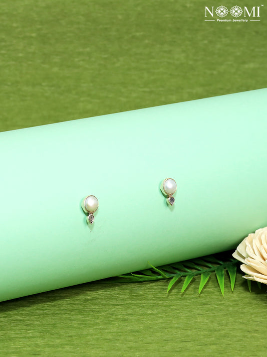 Delicate Pearl Stud Earrings. Designer Earrings in 925 Silver.